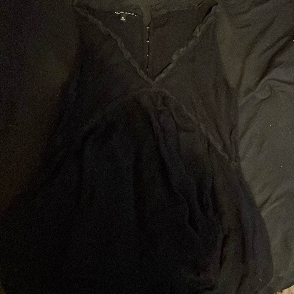 Its a tank top with a flurry bottom and with buttons on the back